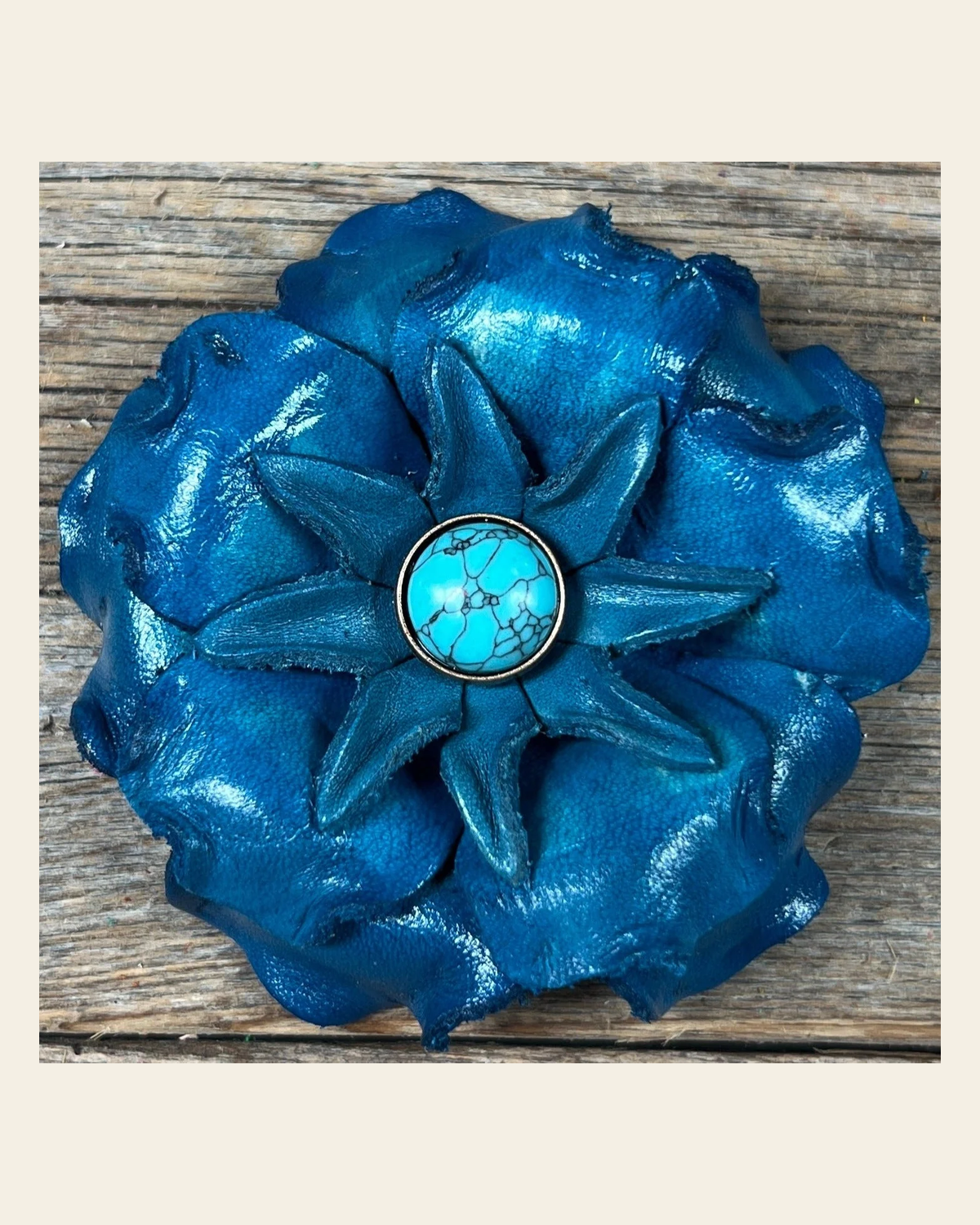 Turquoise Gardenia Flower With Round Turquoise Cabochon on a warm cream background