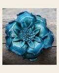 Turquoise Gardenia Leather Flower on a warm cream background