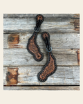 Two Tone Honeycomb Tooled Spur Straps on a warm cream background
