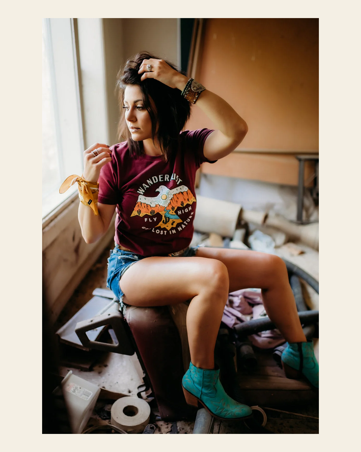 Wanderlust Thunderbird - Maroon Tee on a warm cream background