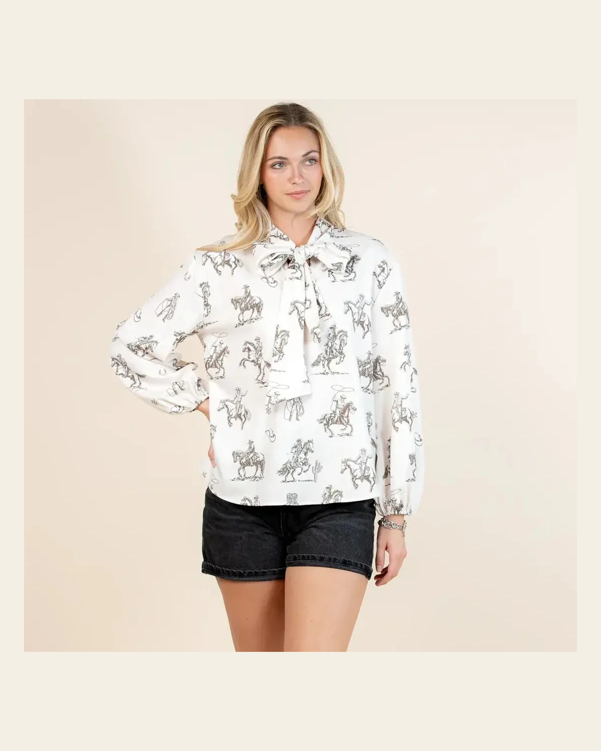 Western Sheriff Tie Neck | Top on a warm cream background