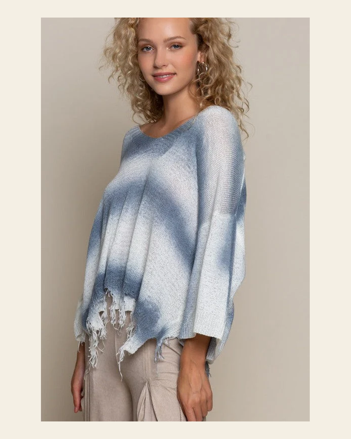 White/blue Stripe Distressed Sweater Top on a warm cream background