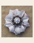White Carnation Flower With Antique Silver AB 1" Concho on a warm cream background