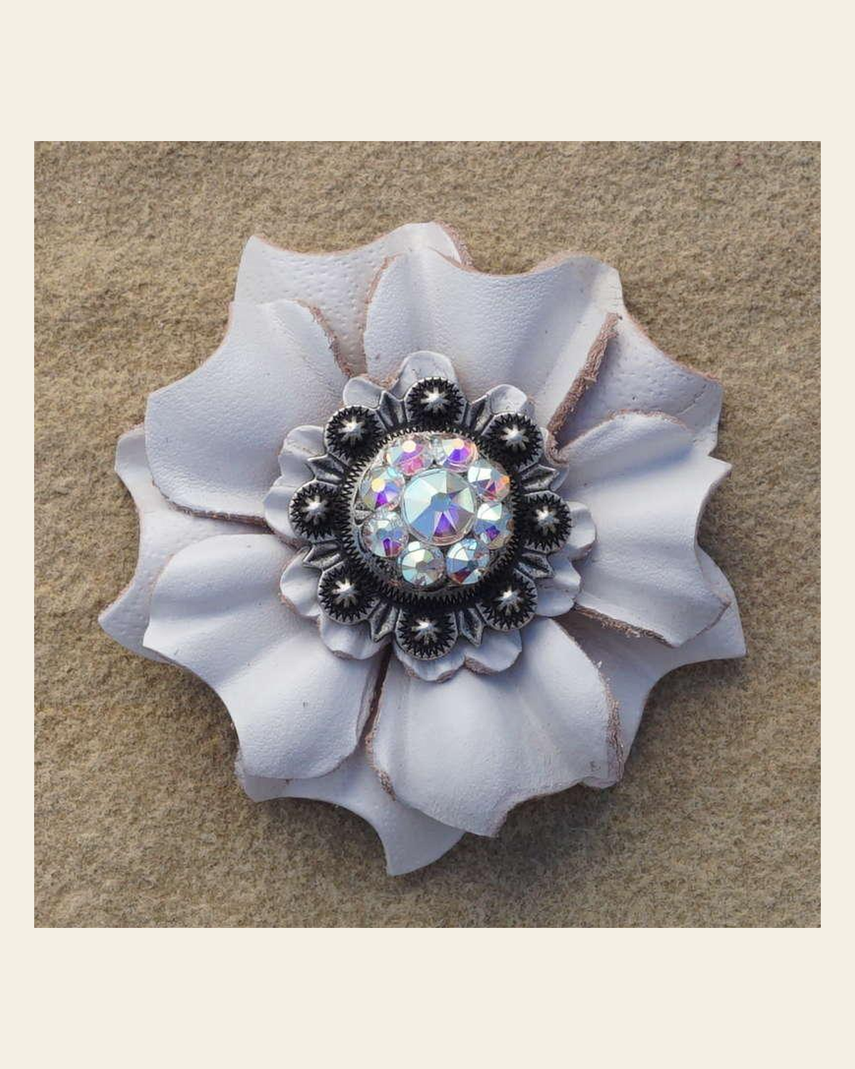 White Carnation Flower With Antique Silver AB 1" Concho on a warm cream background