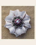 White Carnation Flower With Antique Silver Amethyst and AB 1" Concho on a warm cream background