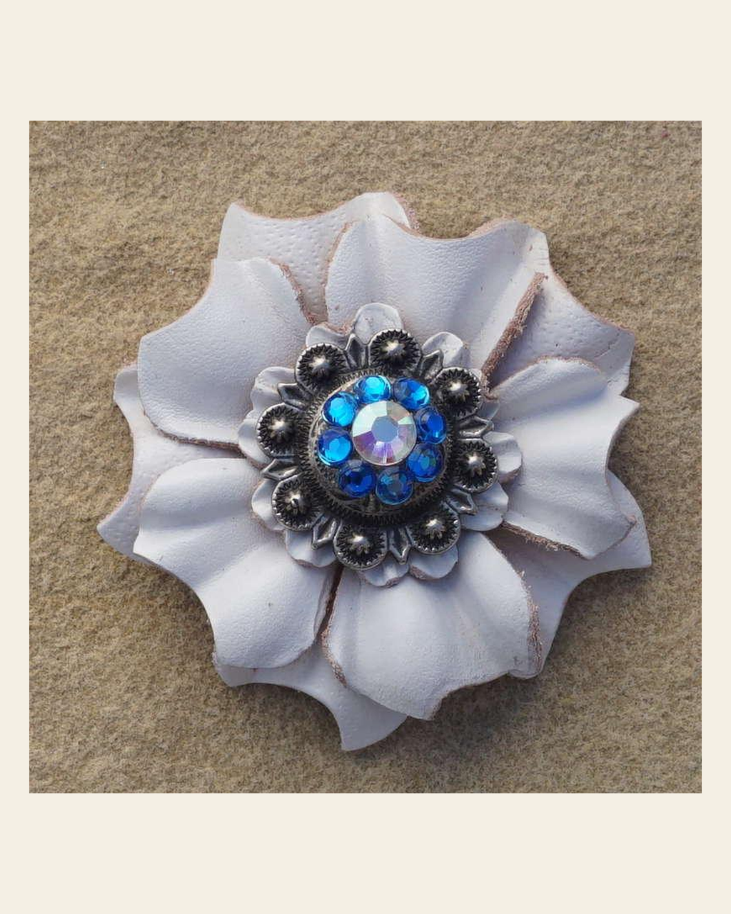 White Carnation Flower With Antique Silver Capri and AB 1" Concho on a warm cream background