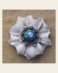 White Carnation Flower With Antique Silver Capri and AB 1" Concho on a warm cream background