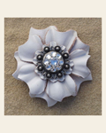 White Carnation Flower With Antique Silver Clear 1" Concho on a warm cream background