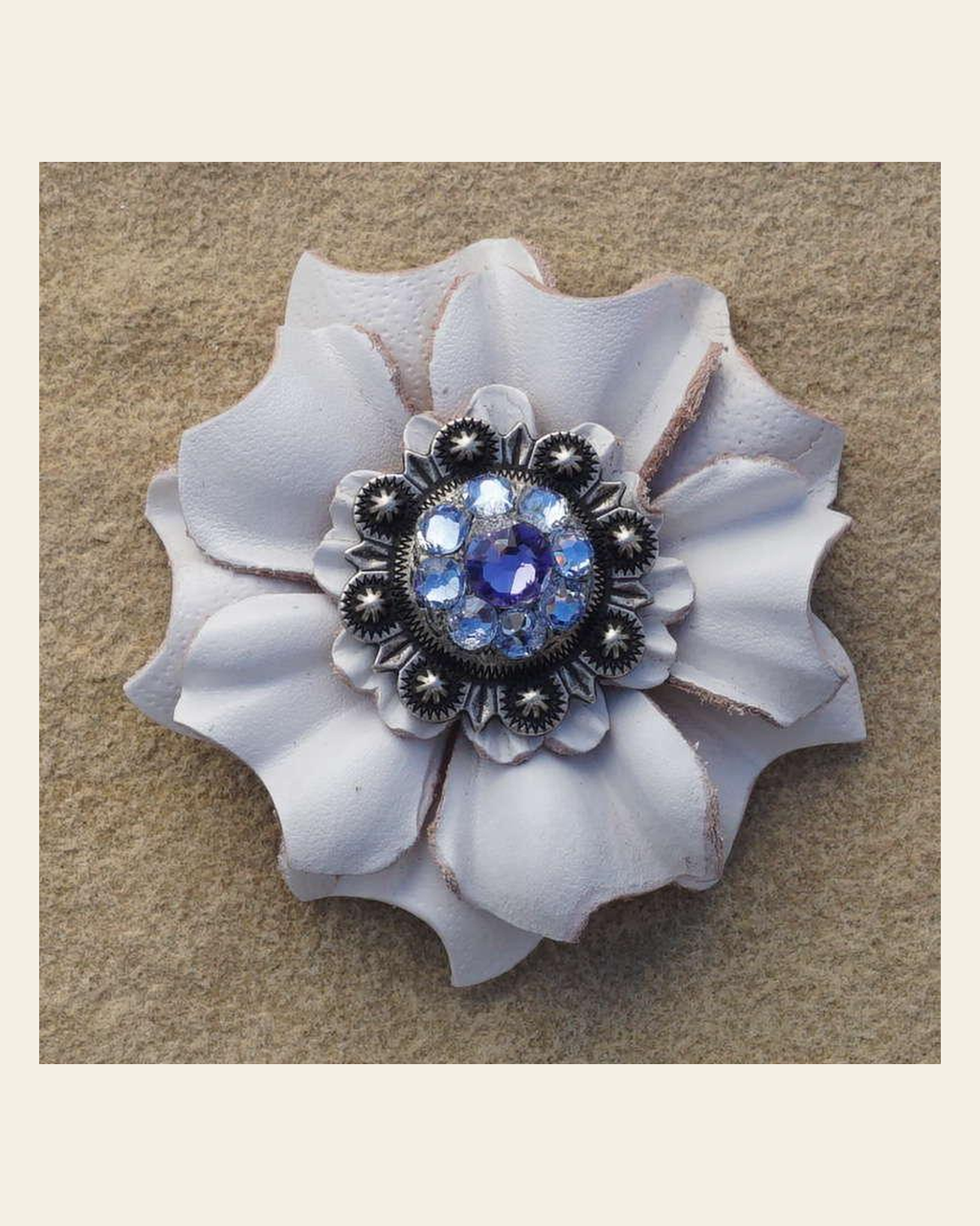 White Carnation Flower With Antique Silver Lilac and Light Sapphire 1" Concho on a warm cream background