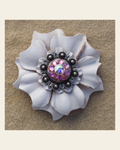 White Carnation Flower With Antique Silver Pink and AB 1" Concho on a warm cream background
