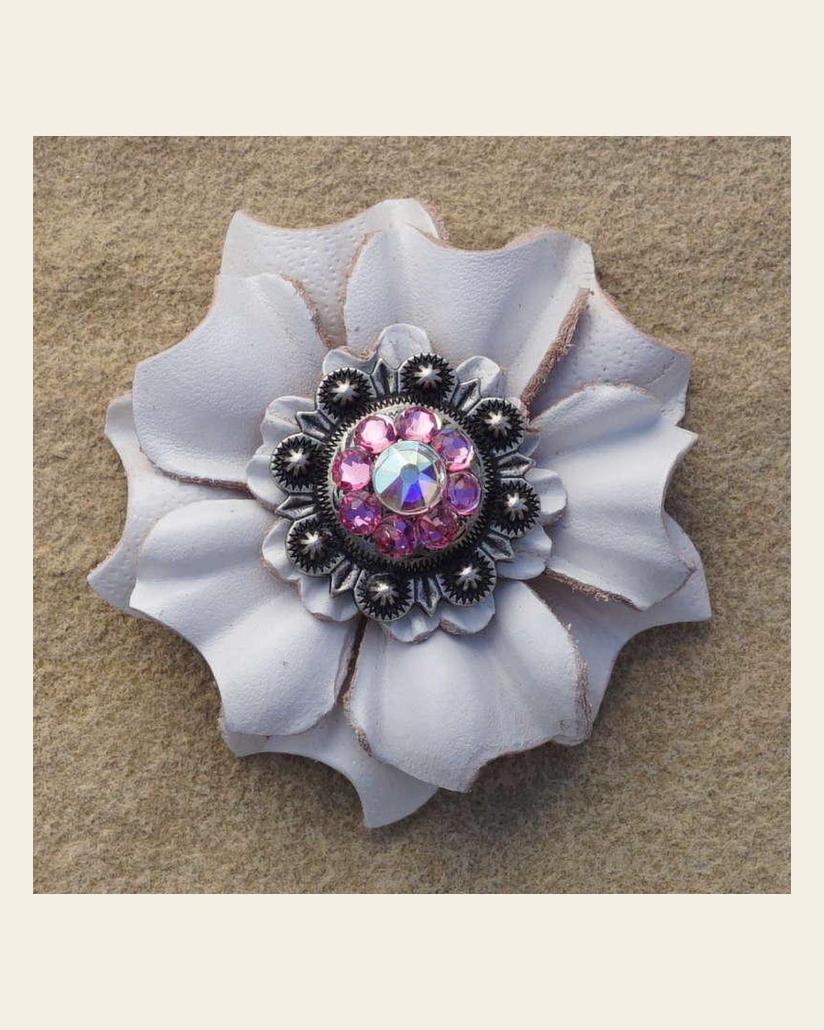 White Carnation Flower With Antique Silver Pink and AB 1" Concho on a warm cream background