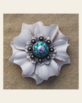 White Carnation Flower With Antique Silver Teal and AB 1" Concho on a warm cream background