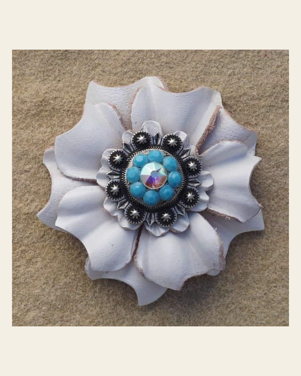 White Carnation Flower With Antique Silver Turquoise & AB 1" Concho on a warm cream background