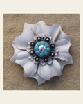 White Carnation Flower With Antique Silver Turquoise & AB 1" Concho on a warm cream background