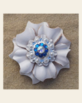 White Carnation Flower With Bright Silver Capri & AB 1" Concho on a warm cream background