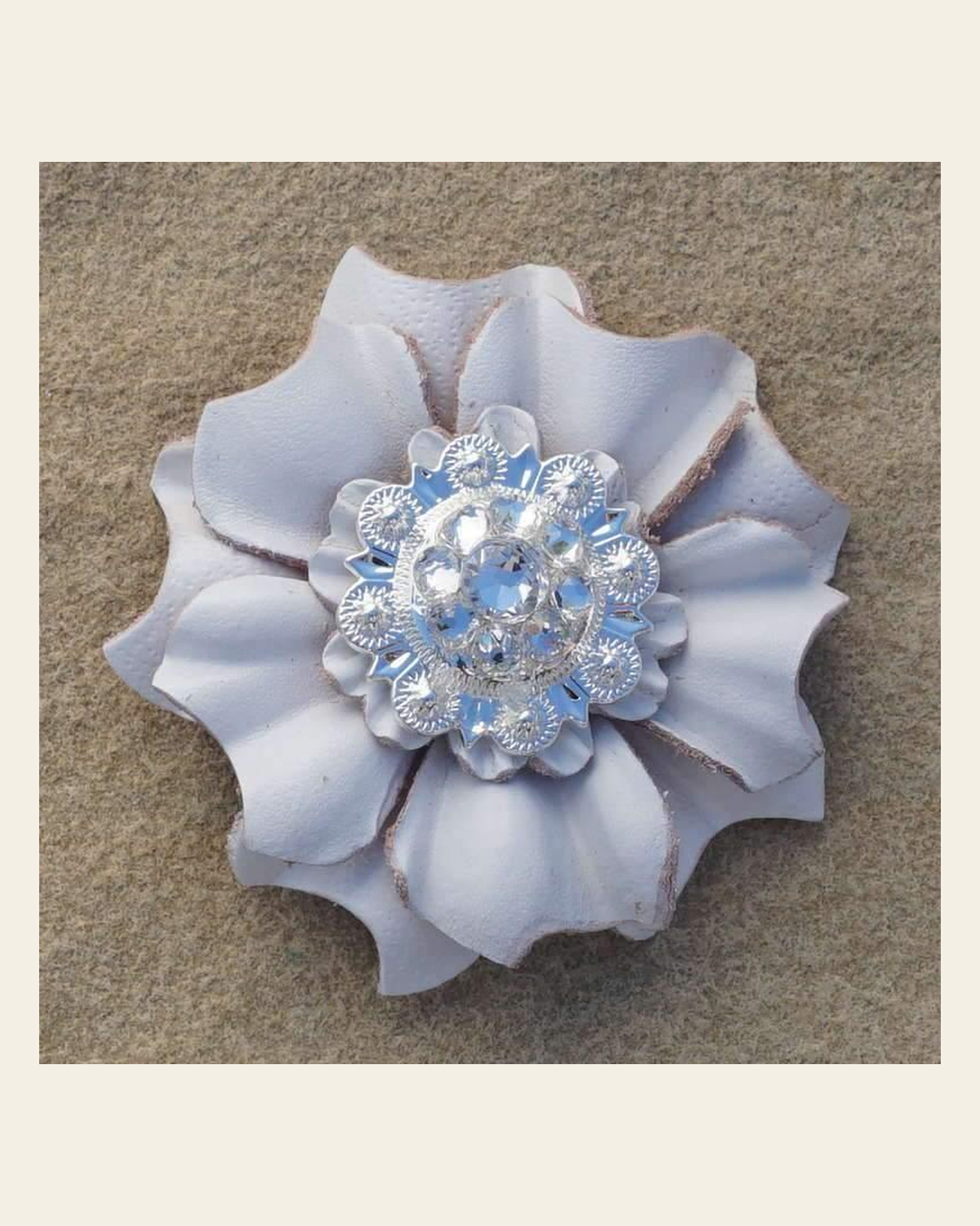 White Carnation Flower With Bright Silver Clear 1" Concho on a warm cream background