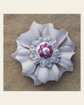 White Carnation Flower With Bright Silver Fuchsia and AB 1" Concho on a warm cream background