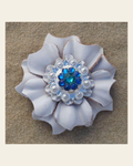 White Carnation Flower With Bright Silver Teal and Capri 1" Concho on a warm cream background