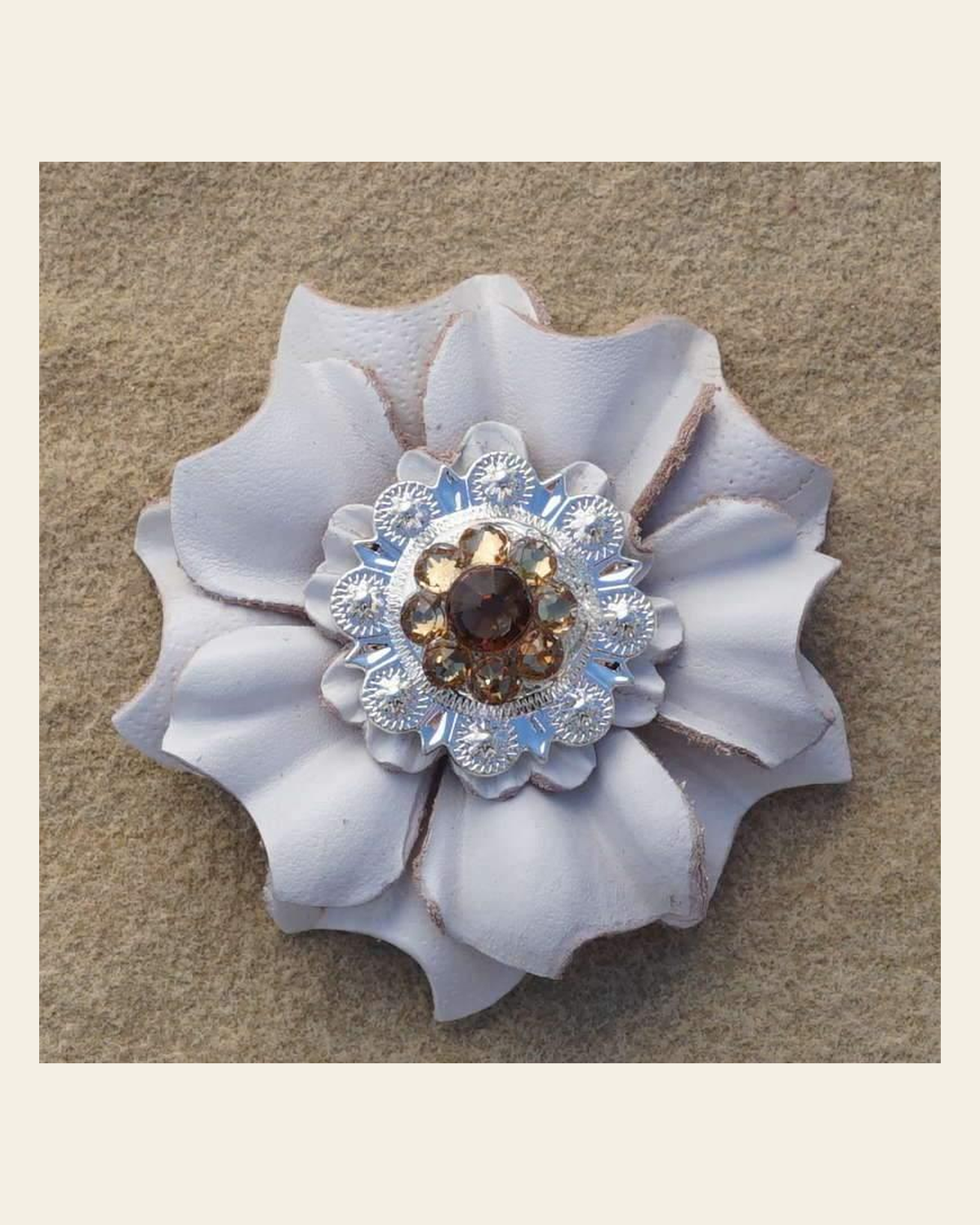 White Carnation Flower With Bright Silver Topaz & Champagne 1" Concho on a warm cream background