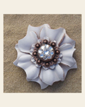 White Carnation Flower With Copper Clear 1" Concho on a warm cream background
