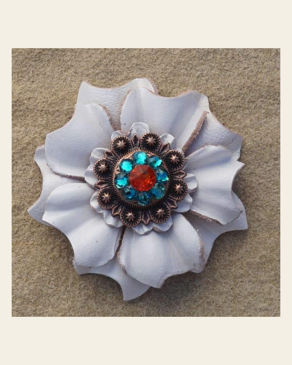White Carnation Flower With Copper Fire Opal & Teal 1" Concho on a warm cream background