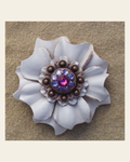 White Carnation Flower With Copper Fuchsia and Lilac 1" Concho on a warm cream background
