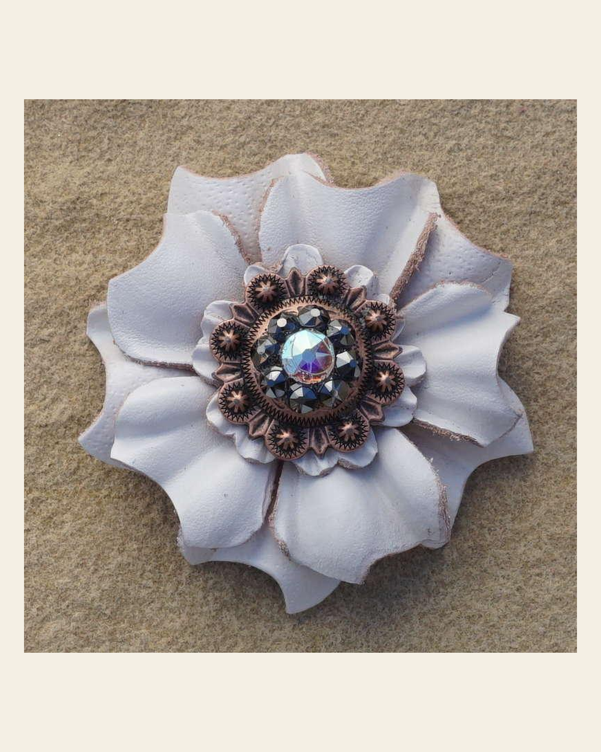 White Carnation Flower With Copper Jet and AB 1" Concho on a warm cream background