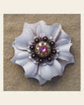 White Carnation Flower With Copper Pink and Champagne 1" Concho on a warm cream background