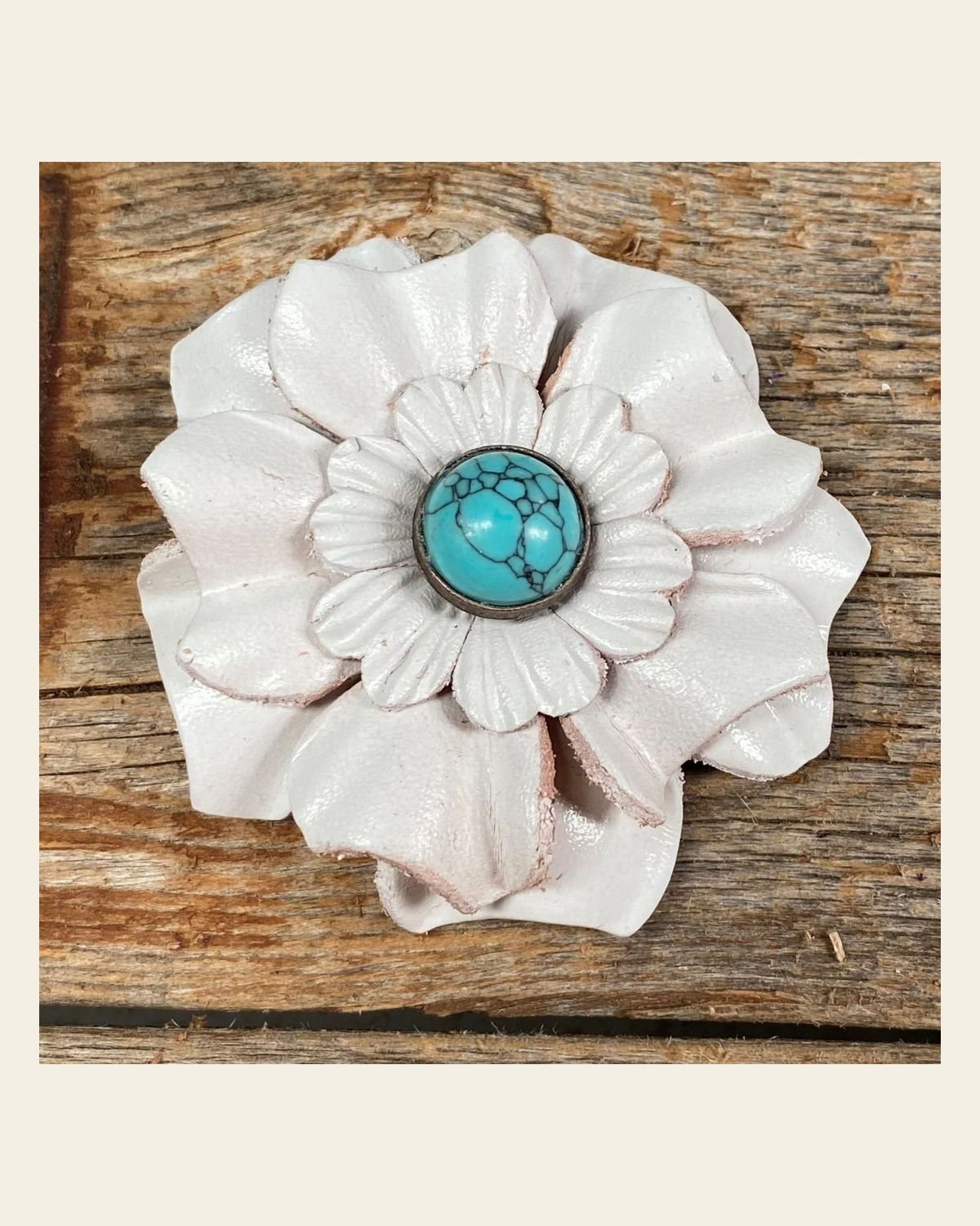 White Carnation Flower With Round Turquoise Cabochon on a warm cream background