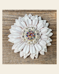 White Daisy Flower With Bright Silver AB 1" Concho on a warm cream background