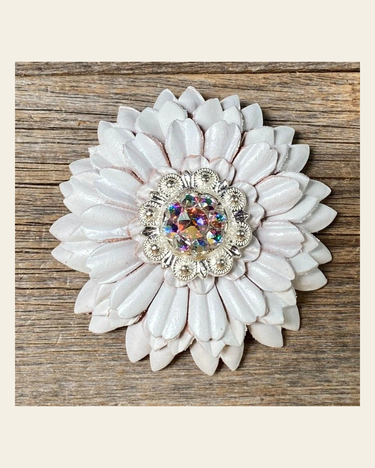 White Daisy Flower With Bright Silver AB 1" Concho on a warm cream background