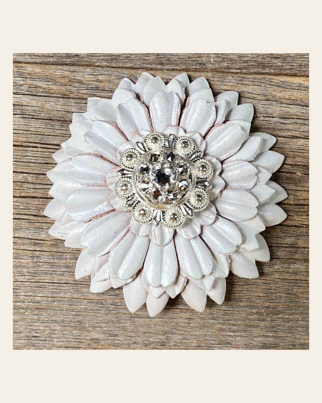 White Daisy Flower With Bright Silver Clear 1" Concho on a warm cream background