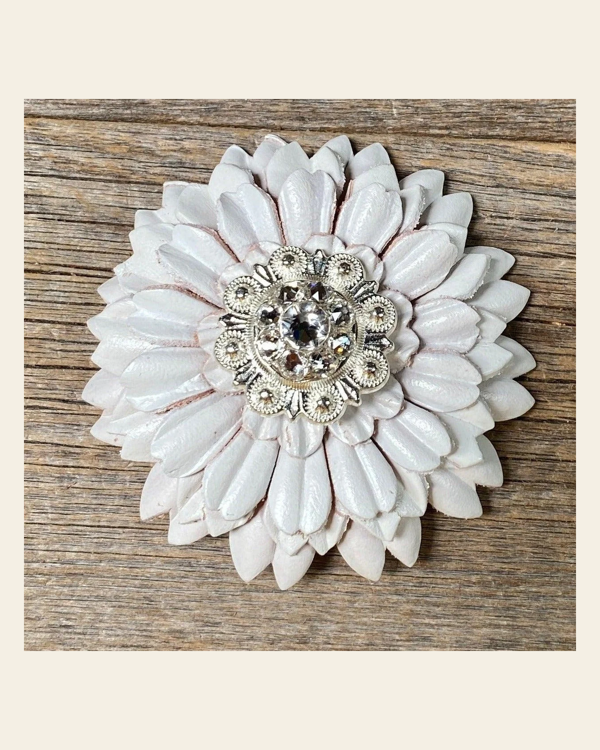White Daisy Flower With Bright Silver Clear 1" Concho on a warm cream background