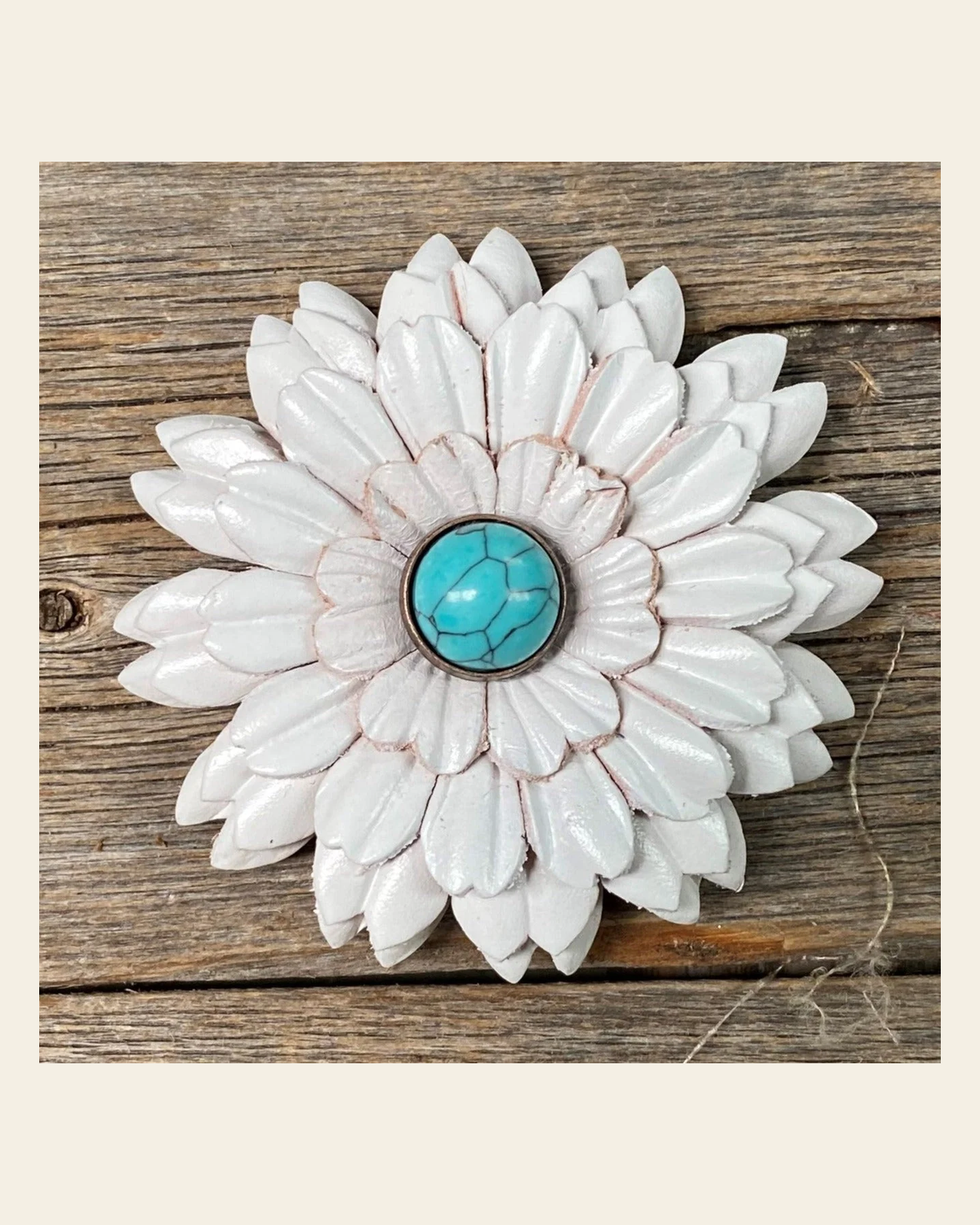 White Daisy Flower With Round Turquoise Cabochon on a warm cream background