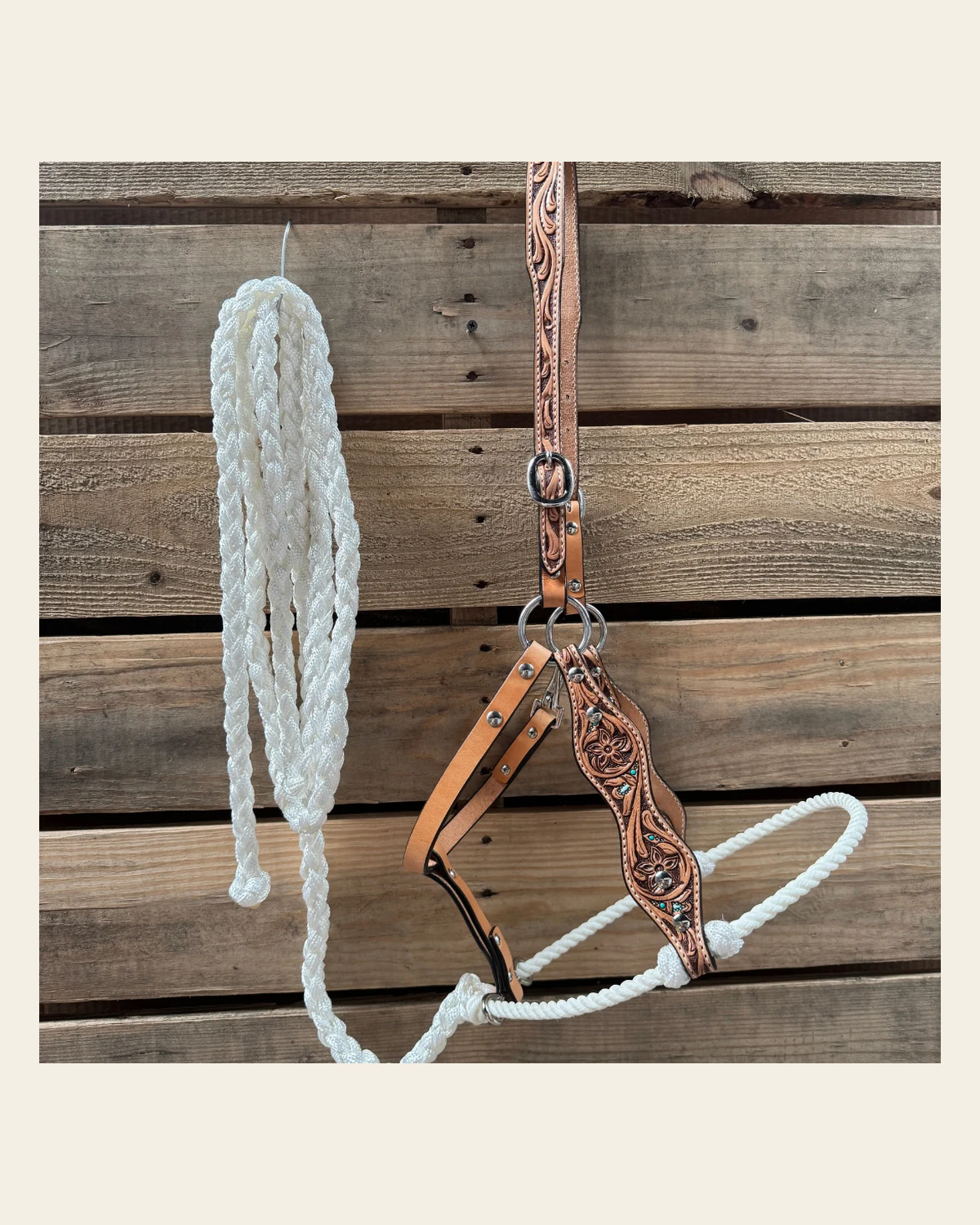 White Floral Tooled Lariat & Leather Combo Halter on a warm cream background