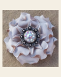 White Gardenia Flower With Antique Silver AB 1" Concho on a warm cream background