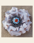 White Gardenia Flower With Antique Silver Fire Opal and Aqua 1" Concho on a warm cream background