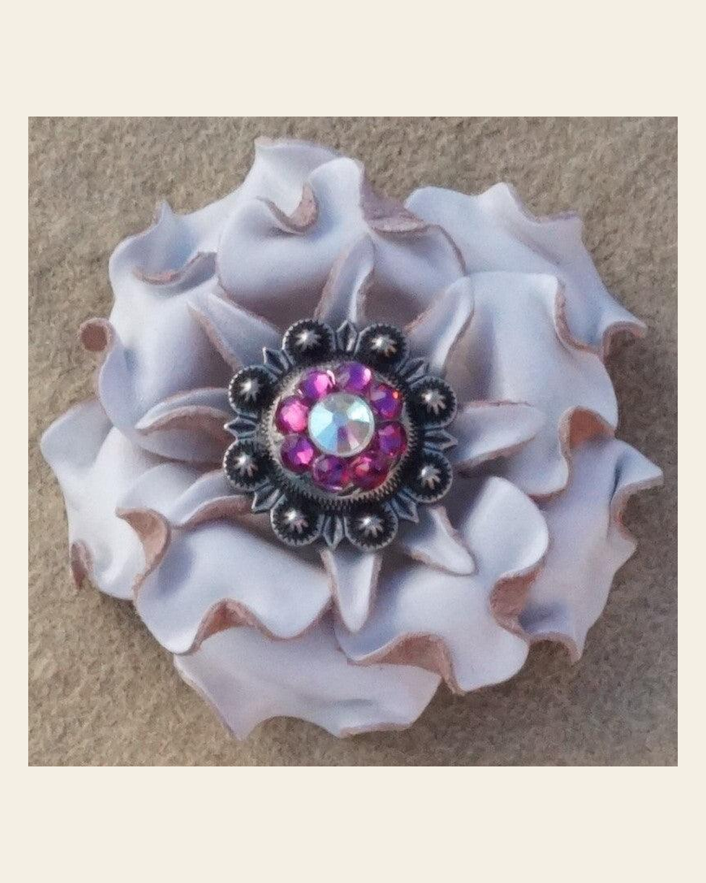 White Gardenia Flower With Antique Silver Fuchsia and AB 1" Concho on a warm cream background