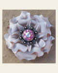 White Gardenia Flower With Antique Silver Pink and AB 1" Concho on a warm cream background
