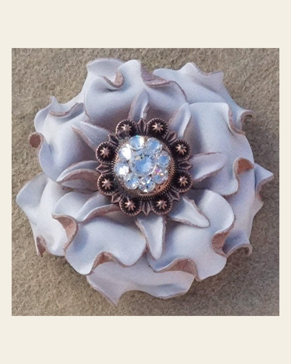 White Gardenia Flower With Copper Clear 1" Concho on a warm cream background