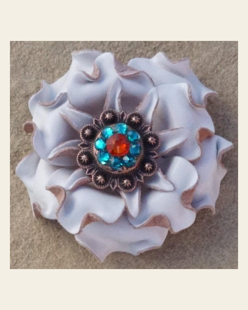 White Gardenia Flower With Copper Fire Opal and Teal 1" Concho on a warm cream background