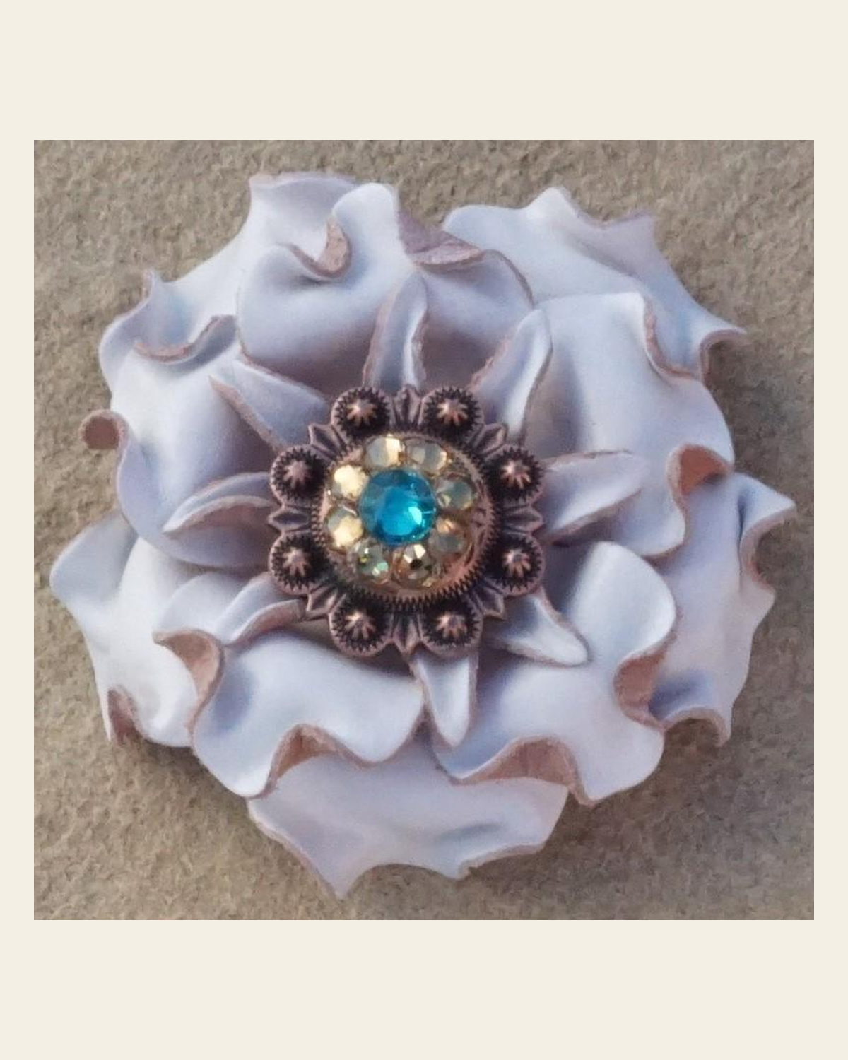White Gardenia Flower With Copper Teal & Champagne 1" Concho on a warm cream background