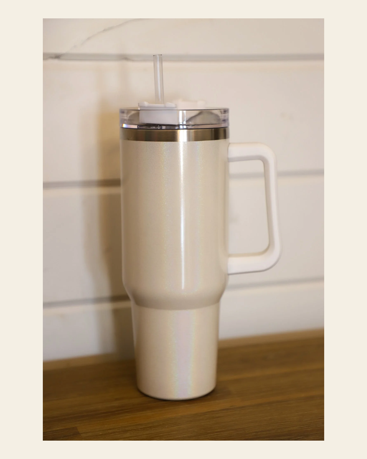 White Iridescent 40 Oz Tumbler on a warm cream background