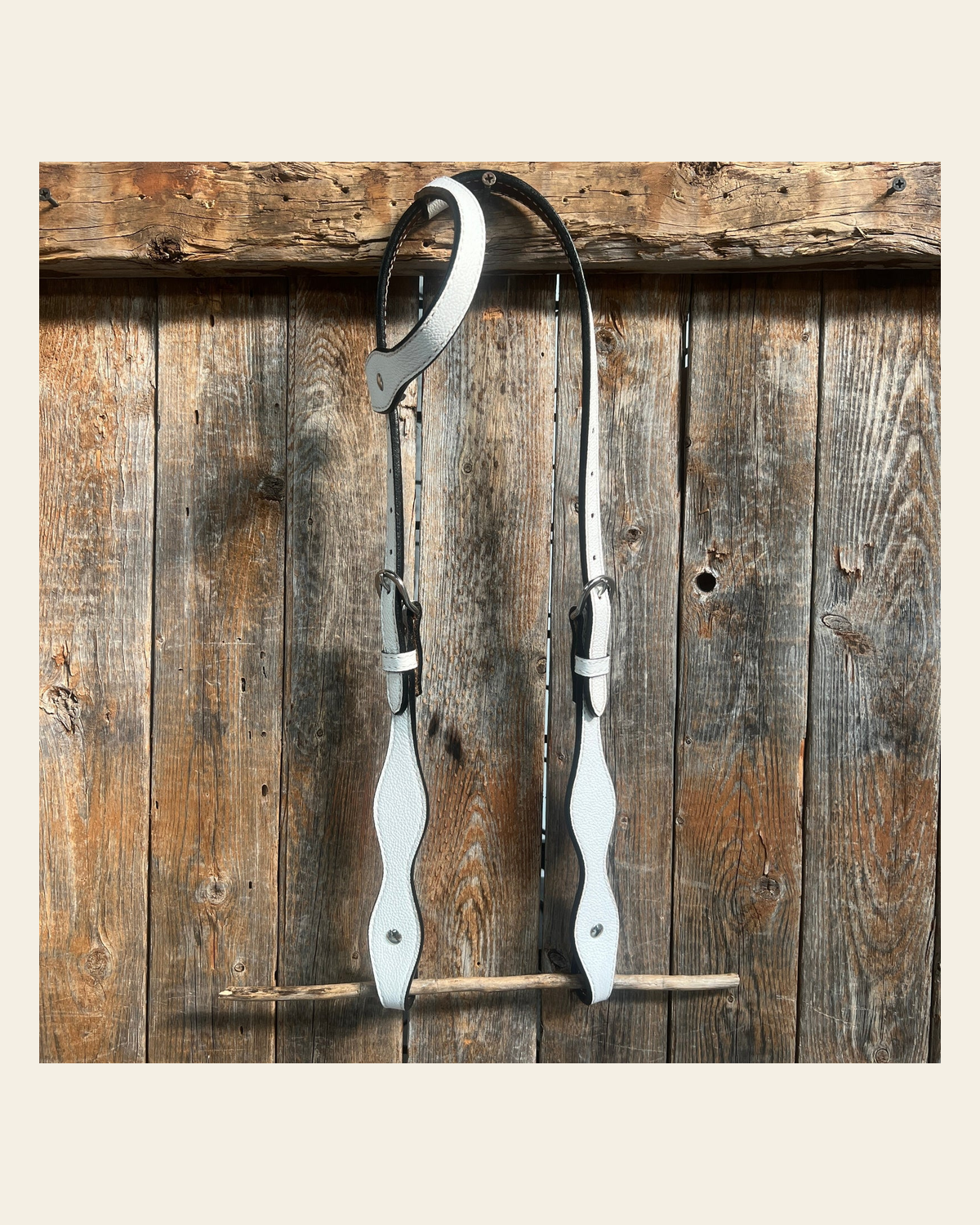 White Genuine Leather One Ear Headstall / Bridle on a warm cream background