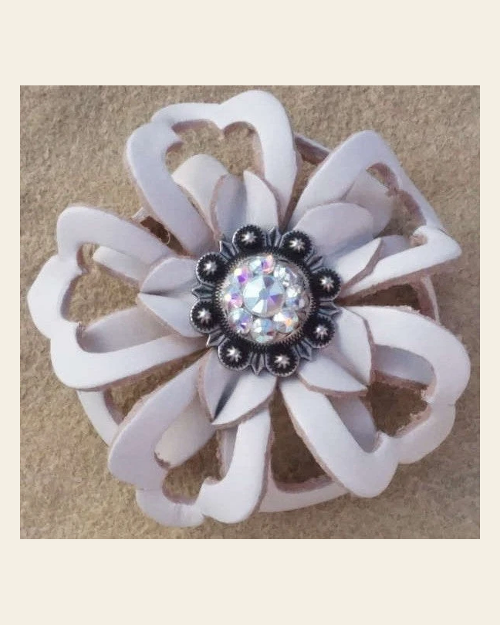 White Lotus Flower With Antique Silver AB 1" Concho on a warm cream background