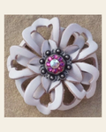 White Lotus Flower With Antique Silver Fuchsia and AB 1" Concho on a warm cream background