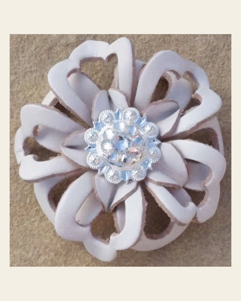 White Lotus Flower With Bright Silver Clear 1" Concho on a warm cream background