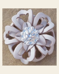 White Lotus Flower With Bright Silver Clear 1" Concho on a warm cream background