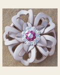 White Lotus Flower With Bright Silver Fuchsia and AB 1" Concho on a warm cream background