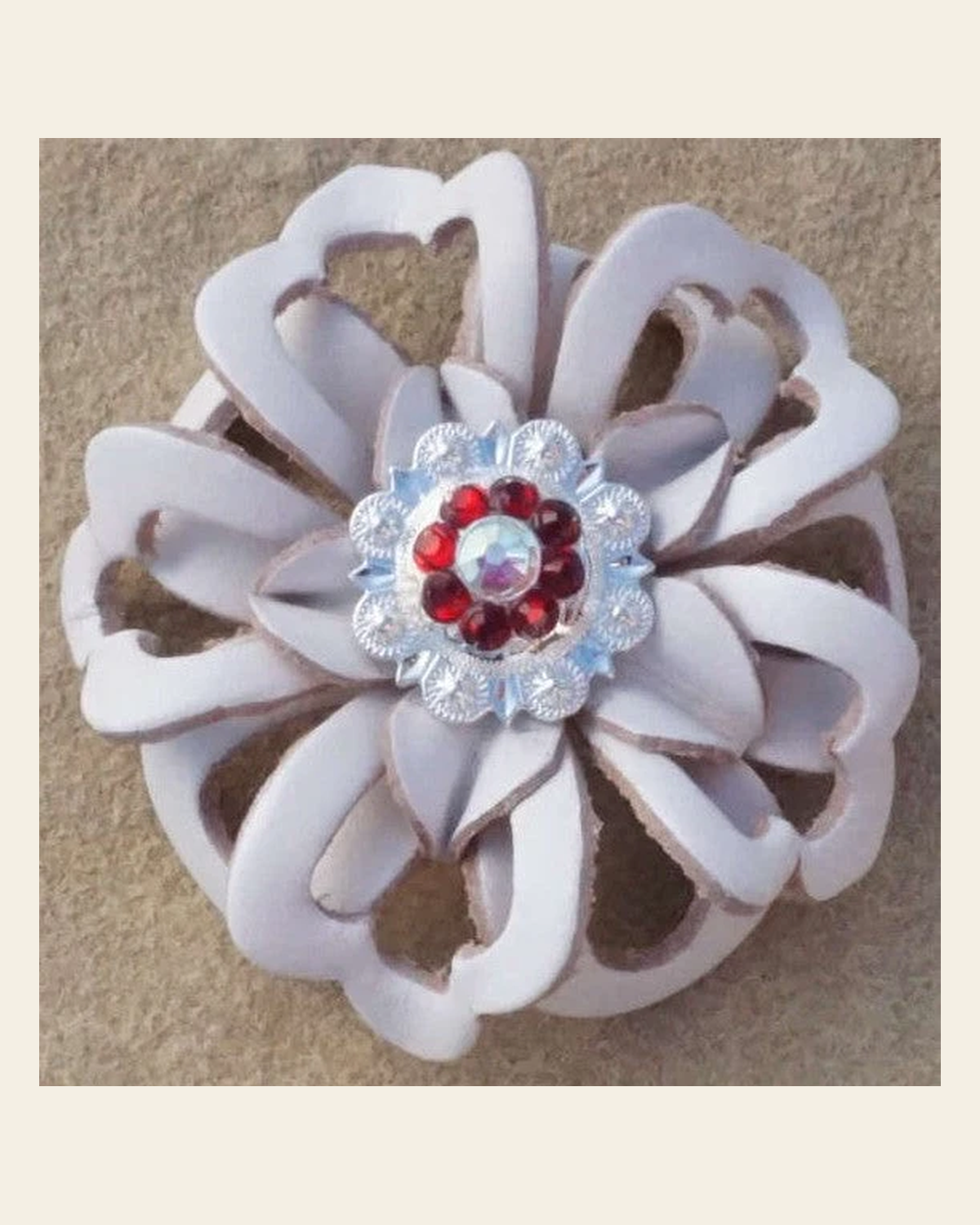 White Lotus Flower With Bright Silver Ruby and AB 1" Concho on a warm cream background